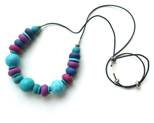 Necklace with  chunky colourful beads on a white background