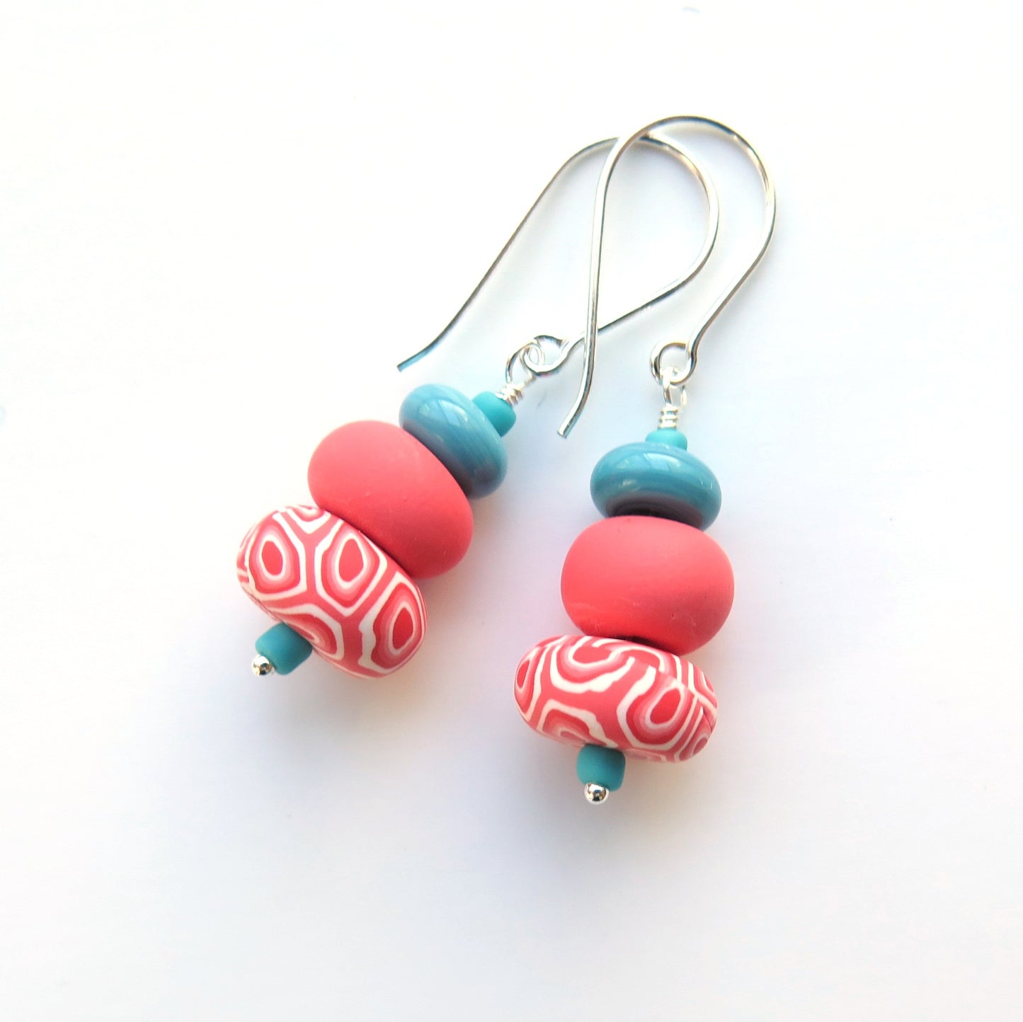 Colorful beaded earrings on a white background