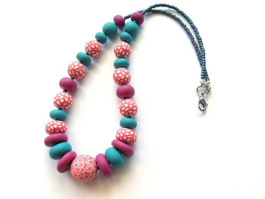 Necklace with colorful beads on a white background